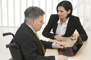 http://www.dreamstime.com/royalty-free-stock-photo-businessman-wheelchair-laptop-working-image37818175